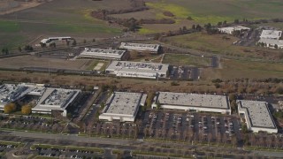 5K aerial stock footage reverse view of business park office buildings in Newark, California Aerial Stock Footage | AXSF11_010