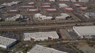 5K aerial stock footage of flying away from office buildings and warehouses, Newark, California Aerial Stock Footage | AXSF11_011