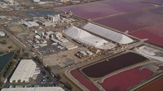 5K aerial stock footage of flying by Morton Salt Plant and salt marshes, Newark, California Aerial Stock Footage | AXSF11_012