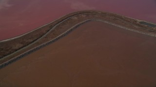 AXSF11_015 - 5K aerial stock footage of flying away from power lines in marshlands, Newark, California