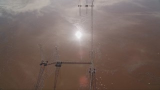 AXSF11_019 - 5K aerial stock footage of a bird's eye view of circling power lines and wetlands, Fremont, California