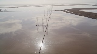 5K aerial stock footage of following a row of power lines and marshlands, Fremont, California Aerial Stock Footage | AXSF11_020