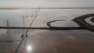 5K aerial stock footage of flying by power lines and marshlands, Sunnyvale, California Aerial Stock Footage | AXSF11_021