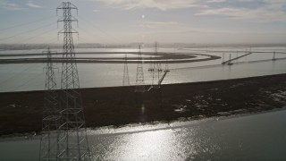 5K aerial stock footage of flying over power lines through marshlands, Sunnyvale, California Aerial Stock Footage | AXSF11_027