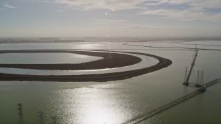 AXSF11_028 - 5K aerial stock footage approach and fly over power lines and wetlands, Sunnyvale, California