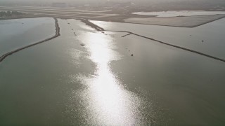 AXSF11_030 - 5K aerial stock footage of panning across power lines in marshlands, Sunnyvale, California