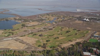 AXSF11_045 - 5K aerial stock footage pan from golf course to reveal Googleplex office buildings, Mountain View, California