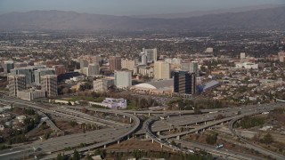 AXSF12_011 - 5K aerial stock footage of convention center in Downtown San Jose, California, seen from freeway interchange