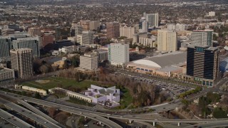 5K aerial stock footage flying over freeway interchange, tilt to reveal Downtown San Jose, California Aerial Stock Footage | AXSF12_012