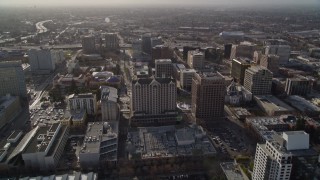 5K aerial stock footage tilt from apartment buildings and fly over Downtown San Jose toward freeway, California Aerial Stock Footage | AXSF12_015