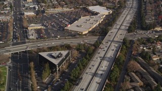 5K aerial stock footage reverse view of neighborhoods beside Interstate 280, reveal shopping center, San Jose, California Aerial Stock Footage | AXSF12_024