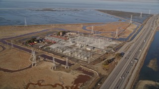 AXSF12_061 - 5K aerial stock footage of a power station beside the Highway 84 freeway, Menlo Park, California