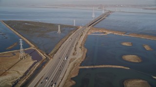 AXSF12_062 - 5K aerial stock footage of flying over Highway 84 freeway, revealing Dumbarton Bridge, Menlo Park, California