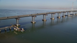 AXSF12_064 - 5K aerial stock footage of flying by Dumbarton Bridge spanning the San Francisco Bay, Menlo Park, California