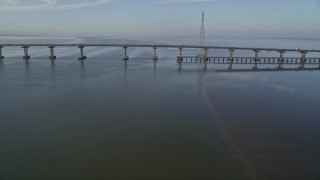 AXSF12_068 - 5K aerial stock footage of approaching Dumbarton Bridge spanning San Francisco Bay, California