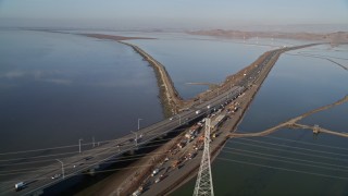 AXSF12_069 - 5K aerial stock footage pan across light traffic on the Dumbarton Bridge, Fremont, California