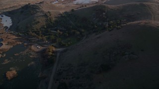 5K aerial stock footage reverse view of country road and marshland at Coyote Hills Regional Park, Fremont, California Aerial Stock Footage | AXSF12_072