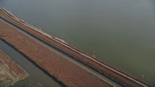 5K aerial stock footage of a reverse view of marshlands and canals, Union City, California Aerial Stock Footage | AXSF12_076