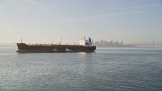 AXSF13_002 - 5K aerial stock footage flyby oil tanker to reveal second tanker on San Francisco Bay, San Francisco, California