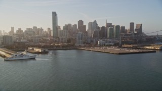 5K aerial stock footage tilt from the bay to reveal and approach One Rincon Hill skyscrapers and skyline of Downtown San Francisco, California Aerial Stock Footage | AXSF13_009