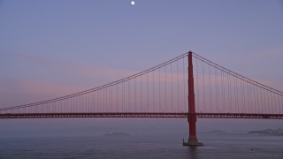 5K aerial stock footage fly low by the Golden Gate Bridge and pan across the span, San Francisco, California, twilight Aerial Stock Footage | AXSF14_047