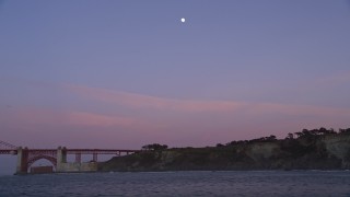 5K aerial stock footage south side of the Golden Gate Bridge, moon overhead, San Francisco, California, twilight Aerial Stock Footage | AXSF14_049