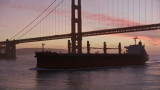 5K aerial stock footage flyby an oil tanker, reveal Golden Gate Bridge, San Francisco, California, twilight Aerial Stock Footage | AXSF14_073