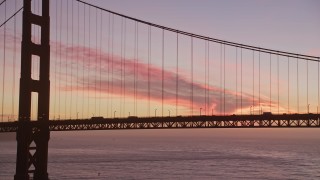 5K aerial stock footage a tower and light traffic on the Golden Gate Bridge, San Francisco, California, twilight Aerial Stock Footage | AXSF14_075