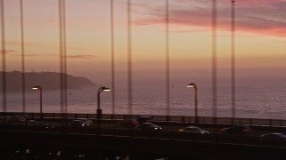 5K aerial stock footage tracking cars on the Golden Gate Bridge, and fly away to a wider view, San Francisco, California, twilight Aerial Stock Footage | AXSF14_077