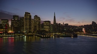 5K aerial stock footage of passing waterfront skyscrapers in Downtown San Francisco, California, twilight Aerial Stock Footage | AXSF14_101