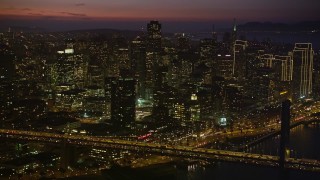 5K aerial stock footage of skyscrapers seen from Bay Bridge, Downtown San Francisco, California, twilight Aerial Stock Footage | AXSF14_110