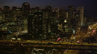 5K aerial stock footage of flying by Bay Bridge, with views of Downtown San Francisco skyscrapers, California, night Aerial Stock Footage | AXSF14_118