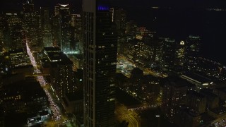 5K aerial stock footage heavy traffic on streets through downtown, reveal One Rincon Hill skyscraper, San Francisco, California, night Aerial Stock Footage | AXSF14_119