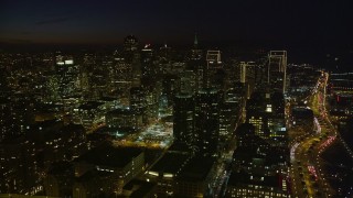 5K aerial stock footage of tall city skyscrapers seen from Bay Bridge, Downtown San Francisco, California, night Aerial Stock Footage | AXSF14_130