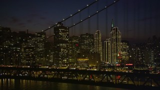 5K aerial stock footage of passing the Bay Bridge and Downtown San Francisco skyscrapers, California, night Aerial Stock Footage | AXSF14_132