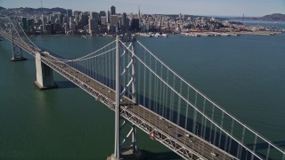 5K aerial stock footage of tilting from the bay revealing Bay Bridge near Downtown San Francisco, California Aerial Stock Footage | AXSF15_005