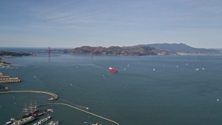 5K aerial stock footage of approaching an oil tanker sailing San Francisco Bay, California with a view of the Golden Gate Bridge Aerial Stock Footage | AXSF15_013