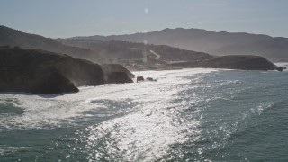 5K aerial stock footage of tilting from the ocean revealing coastal homes, Pacifica, California Aerial Stock Footage | AXSF15_039