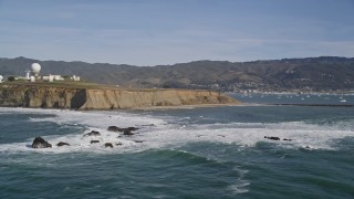 AXSF15_051 - 5K aerial stock footage orbit rock formations, reveal Pillar Point Air Force Station, Half Moon Bay, California