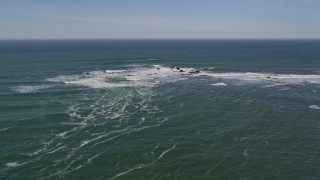 AXSF15_054 - 5K aerial stock footage of descending toward waves crashing into rock formations, Half Moon Bay, California