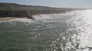 AXSF15_058 - 5K aerial stock footage of flying by coastal cliffs, Half Moon Bay, California