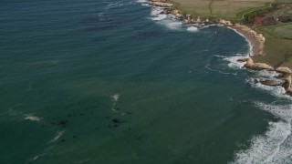 5K aerial stock footage of flying away from coastal cliffs, Santa Cruz, California Aerial Stock Footage | AXSF15_089