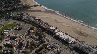 5K aerial stock footage of flying by the beach and rides at Santa Cruz Beach Boardwalk, Santa Cruz, California Aerial Stock Footage | AXSF15_103