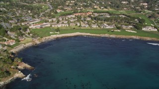 5K aerial stock footage tilt from Carmel Bay, reveal a resort hotel and golf course, Pebble Beach, California Aerial Stock Footage | AXSF16_032