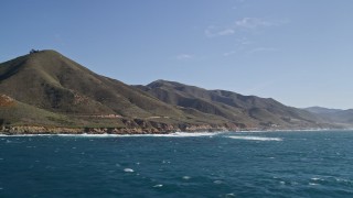 AXSF16_054 - 5K aerial stock footage of flying by the coast and hills, Carmel, California