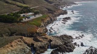 AXSF16_059 - 5K aerial stock footage of a roadside shop by Highway 1 coastal road in Carmel, California