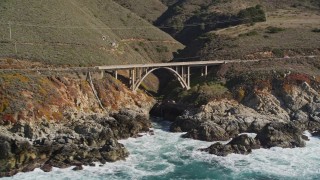 AXSF16_060 - 5K aerial stock footage flying by a bridge spanning a gorge, Highway 1, Carmel, California