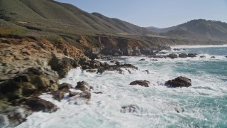 5K aerial stock footage of flying over waves crashing into the coastal cliffs and rock formations, Carmel, California Aerial Stock Footage | AXSF16_061