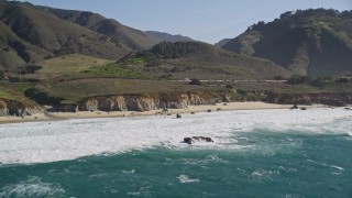 5K aerial stock footage of flying by waves crashing on small beach, Carmel, California Aerial Stock Footage | AXSF16_062