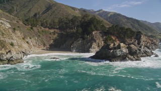 5K aerial stock footage of tilting from the ocean to reveal McWay Falls, Big Sur, California Aerial Stock Footage | AXSF16_121